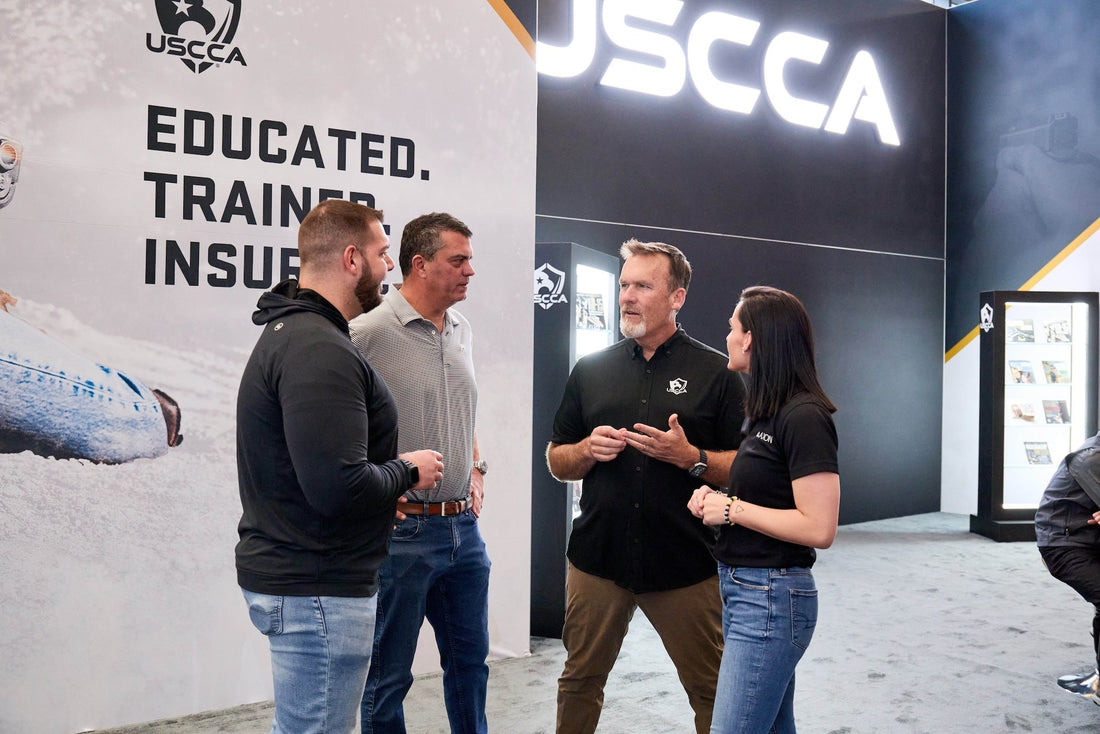 A group of people standing and talking